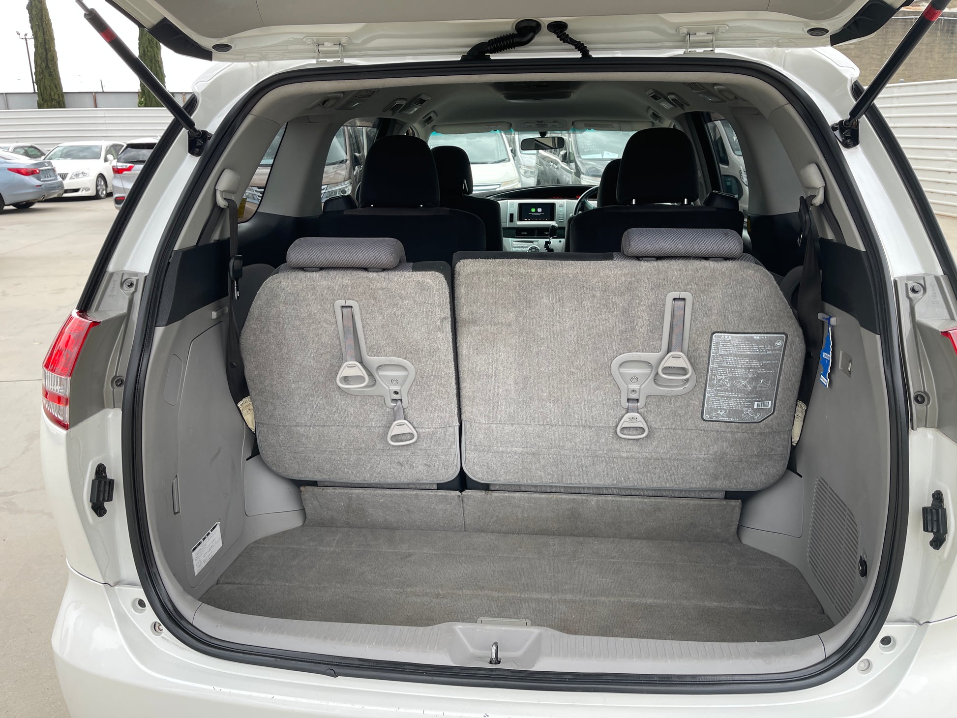 2006 Toyota Estima Aeras V6 3.5L interior view showing rear seats folded down for more cargo space.
