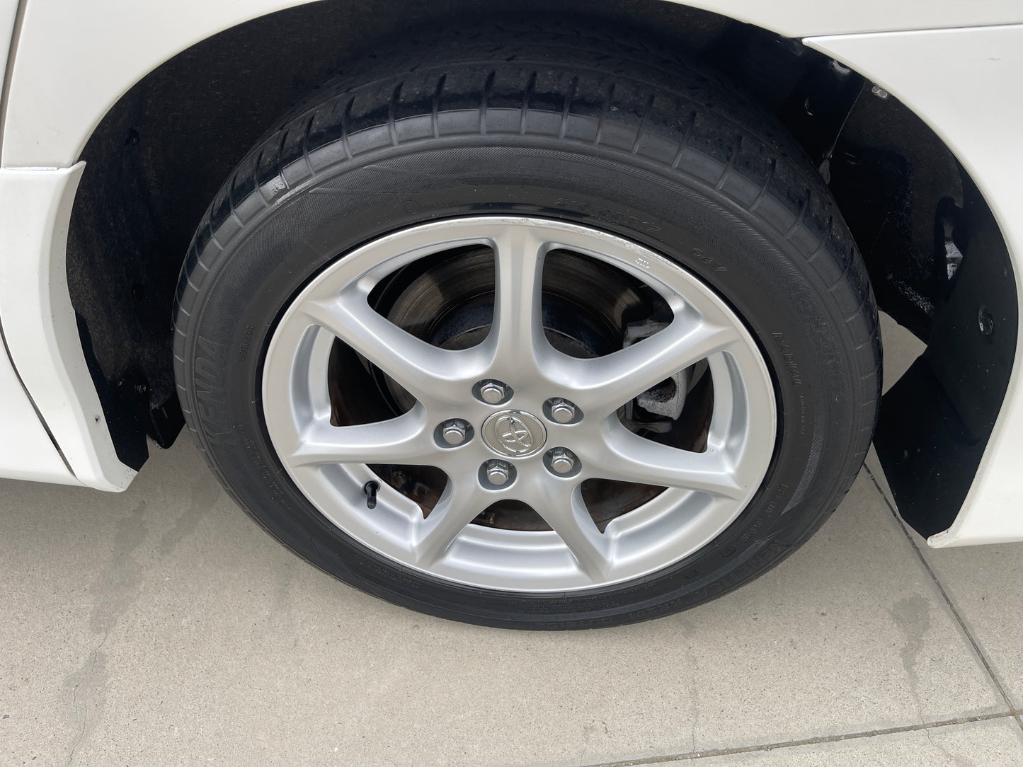 Close-up view of the wheel and tire of a 2006 Toyota Estima Aeras V6 3.5L.