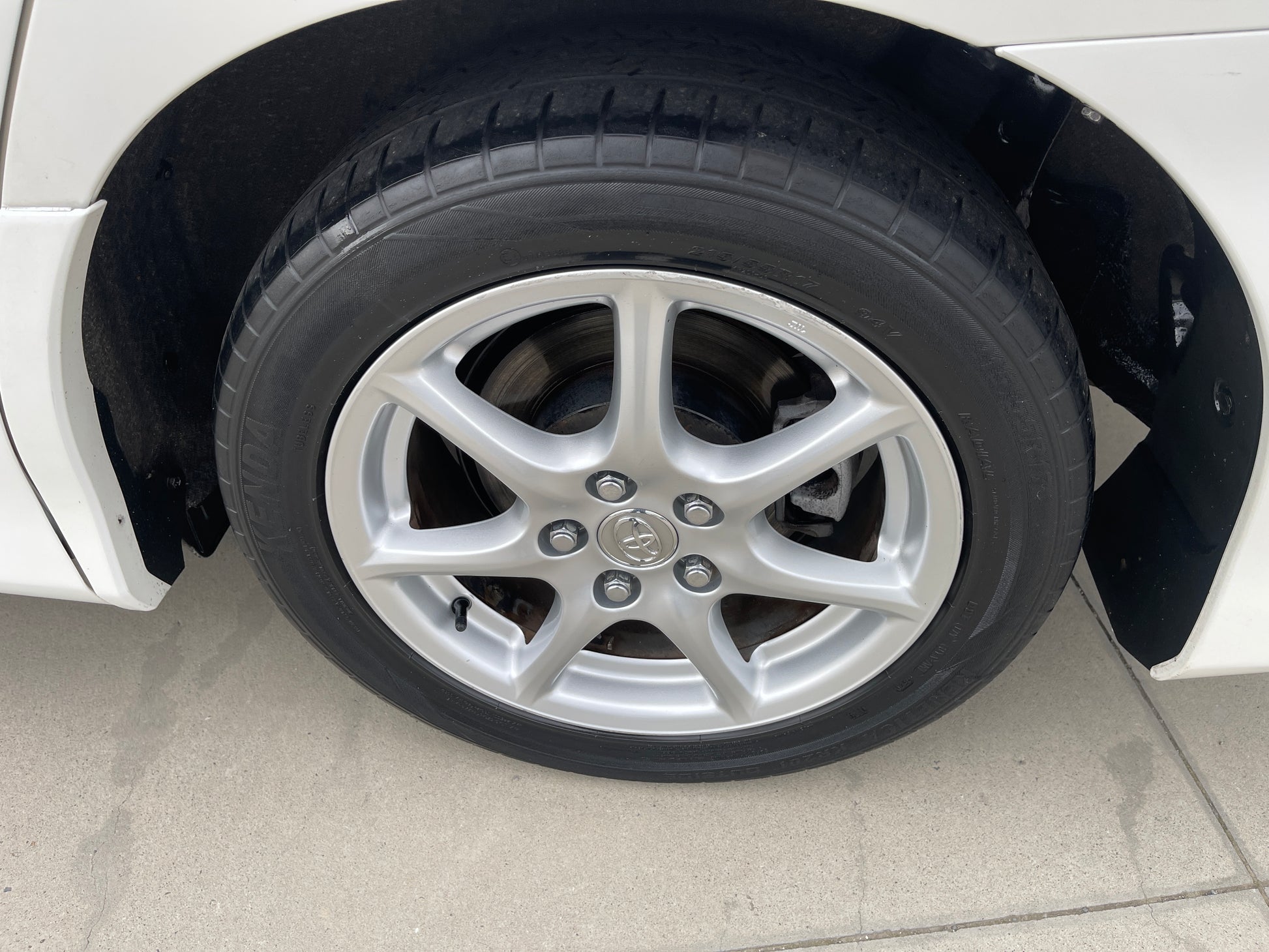 Close-up view of the wheel and tire of a 2006 Toyota Estima Aeras V6 3.5L.