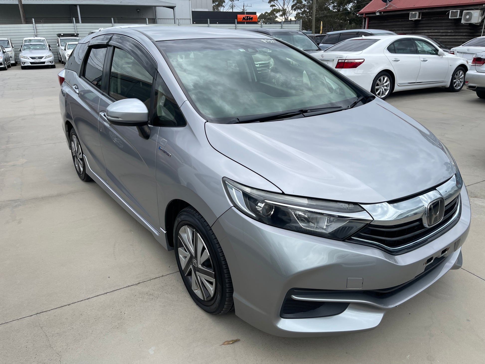 2018 Honda Shuttle 1.5 Hybrid X Honda Sensing Edition in silver, showcasing sleek design and modern features, 5-seater.