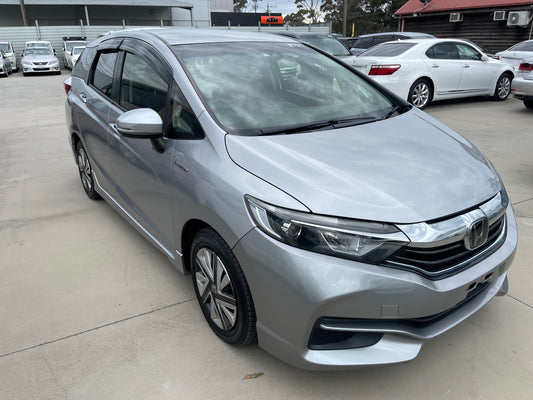 2018 Honda Shuttle 1.5 Hybrid X Honda Sensing Edition in silver, showcasing sleek design and modern features, 5-seater.