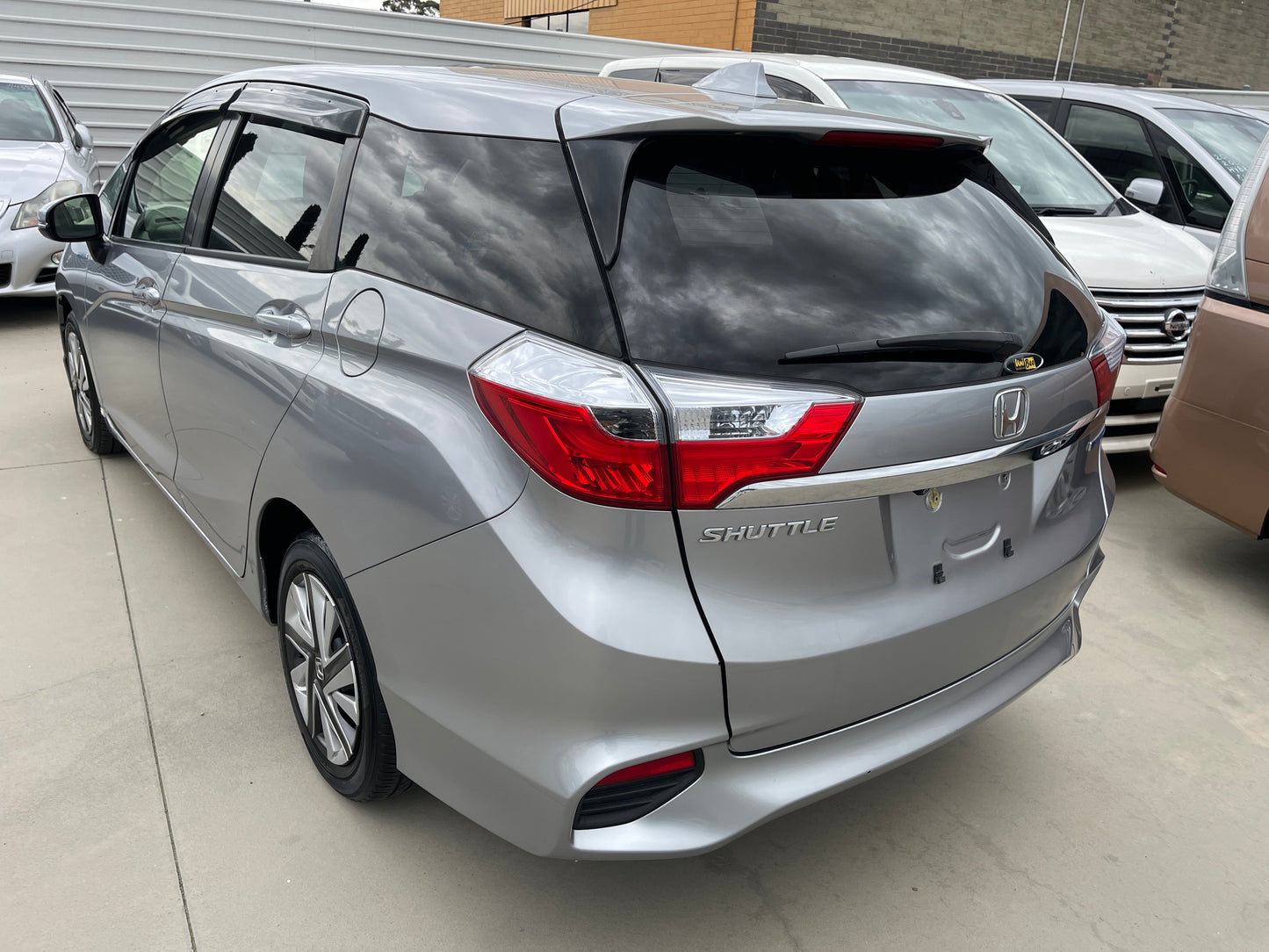 2018 Honda Shuttle 1.5 Hybrid X Honda Sensing Edition silver rear view with SHUTTLE branding