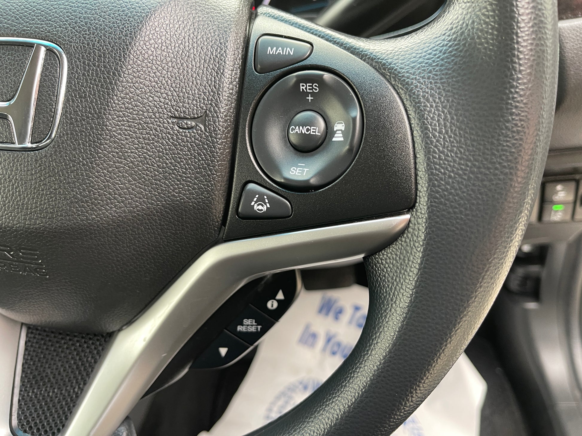 2018 Honda Shuttle 1.5 Hybrid steering wheel controls for adaptive cruise and other features.
