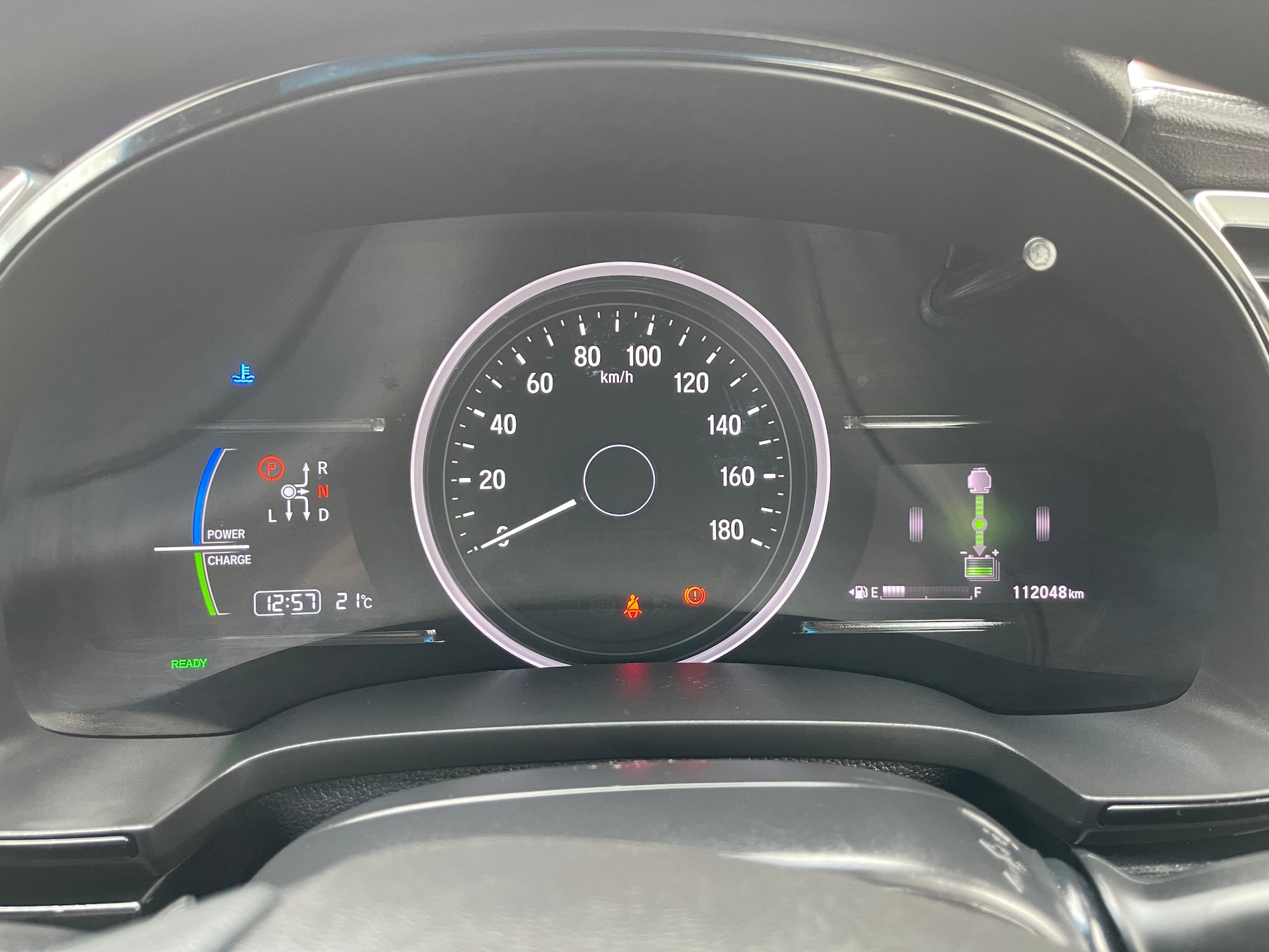 Dashboard display of a 2018 Honda Shuttle 1.5 Hybrid showing speed and various indicators.