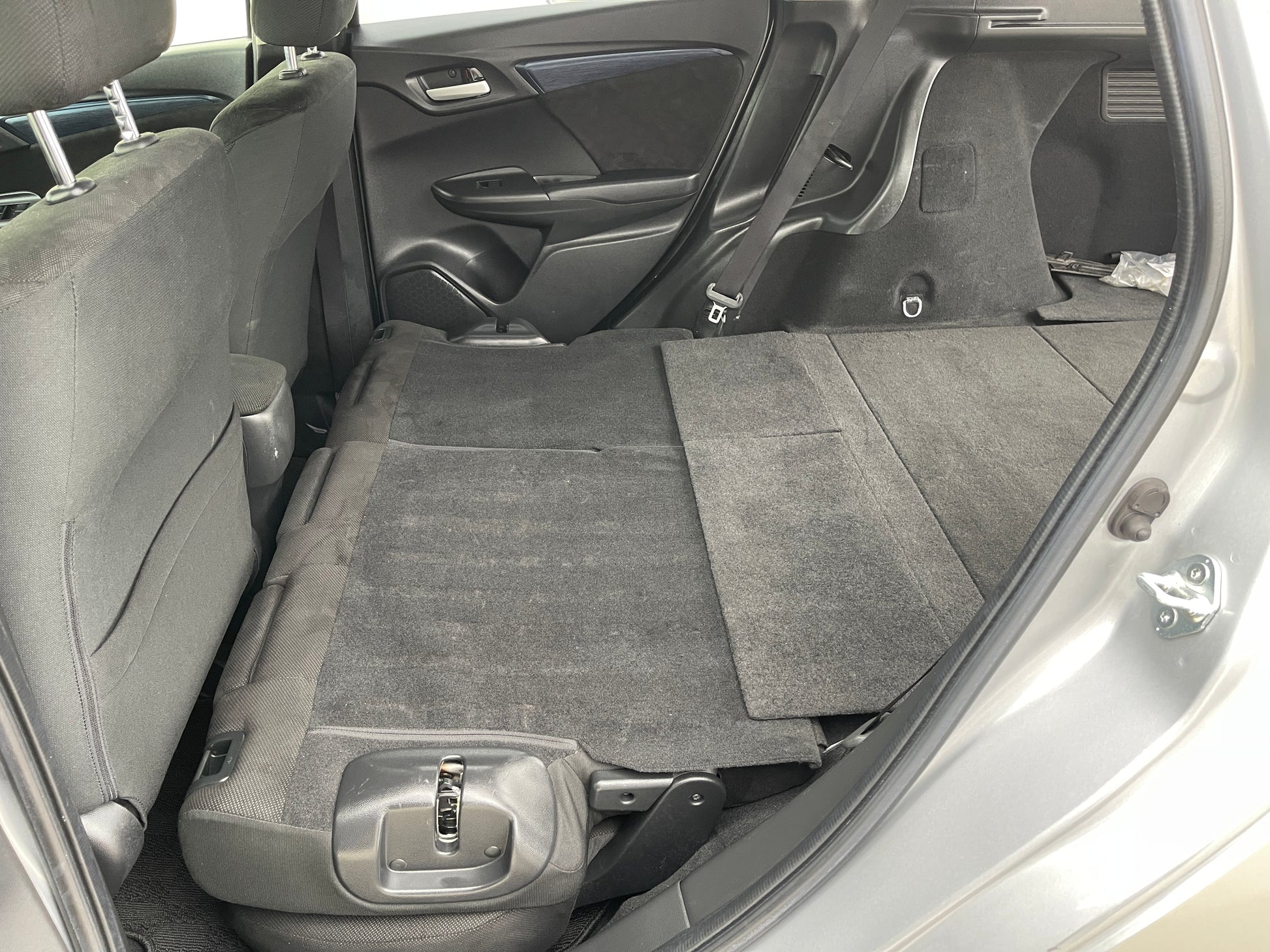 Interior view of 2018 Honda Shuttle 1.5 Hybrid showing spacious cargo area with seats folded down.