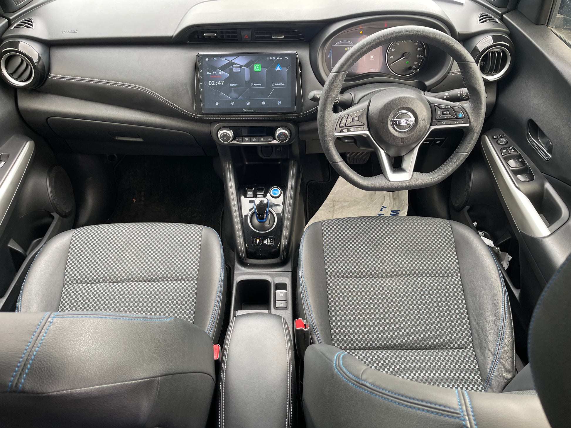 Interior view of the 2020 Nissan Kicks e-Power, featuring modern dashboard and comfortable seating.