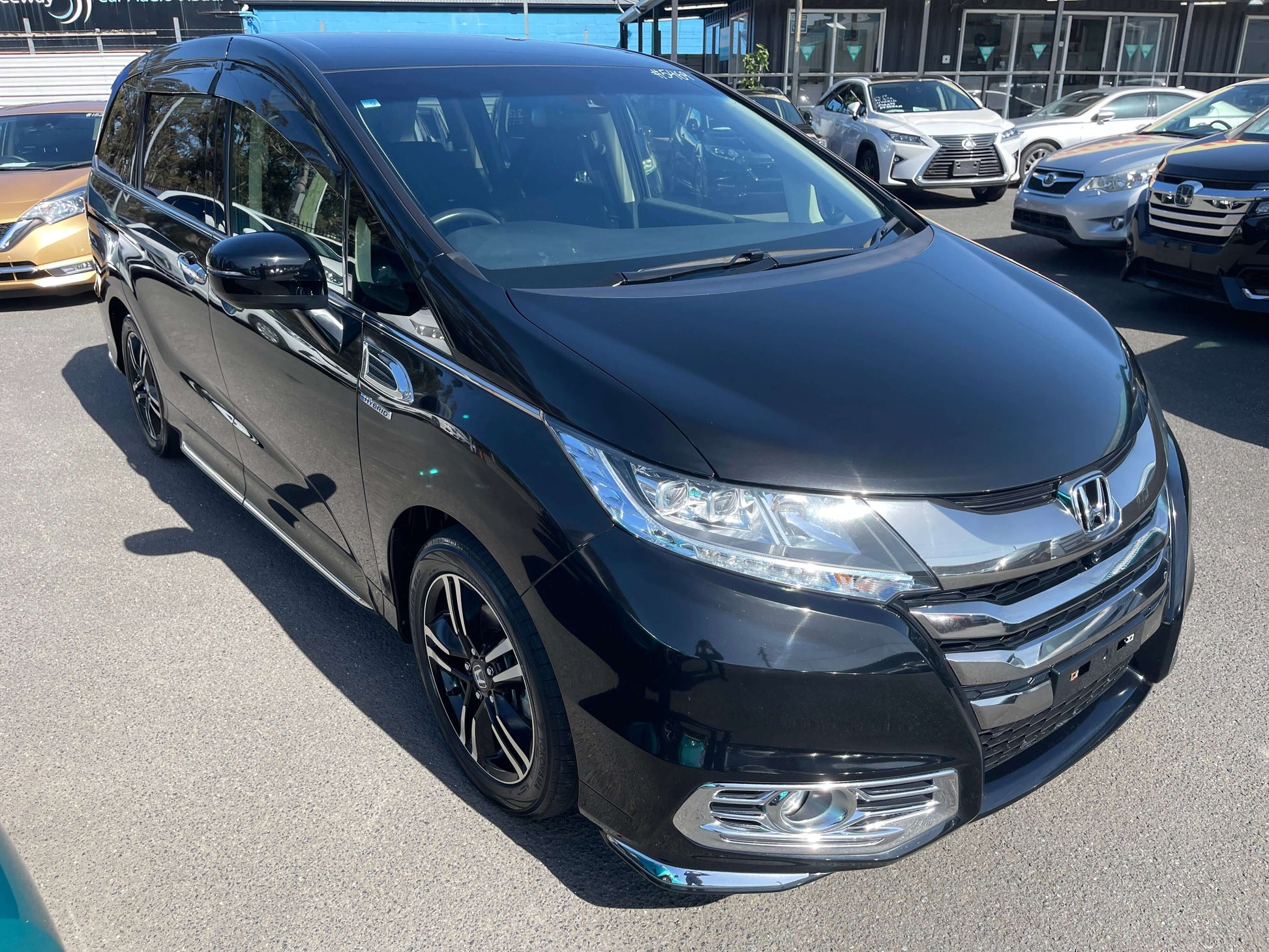 2016 Honda Odyssey 2.0 Hybrid Absolute Honda Sensing 7-seater in black, parked outside.