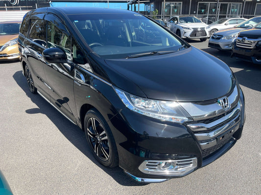 2016 Honda Odyssey 2.0 Hybrid Absolute Honda Sensing 7-seater in black, parked outside.