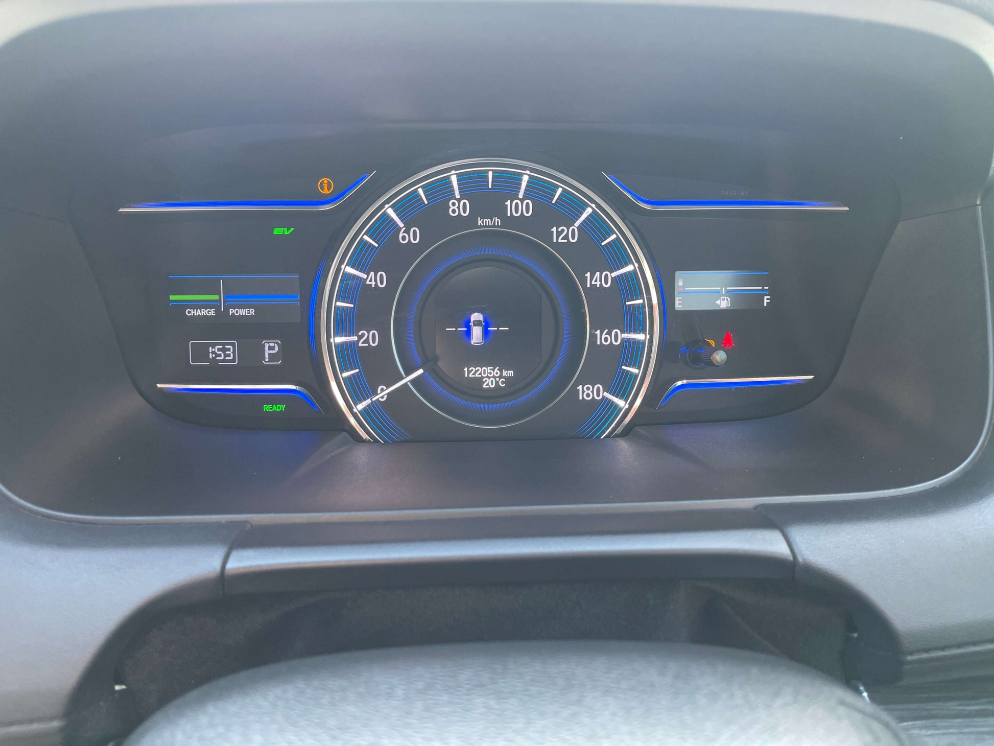2016 Honda Odyssey 2.0 Hybrid dashboard display showing speedometer and indicators for mileage and fuel level.