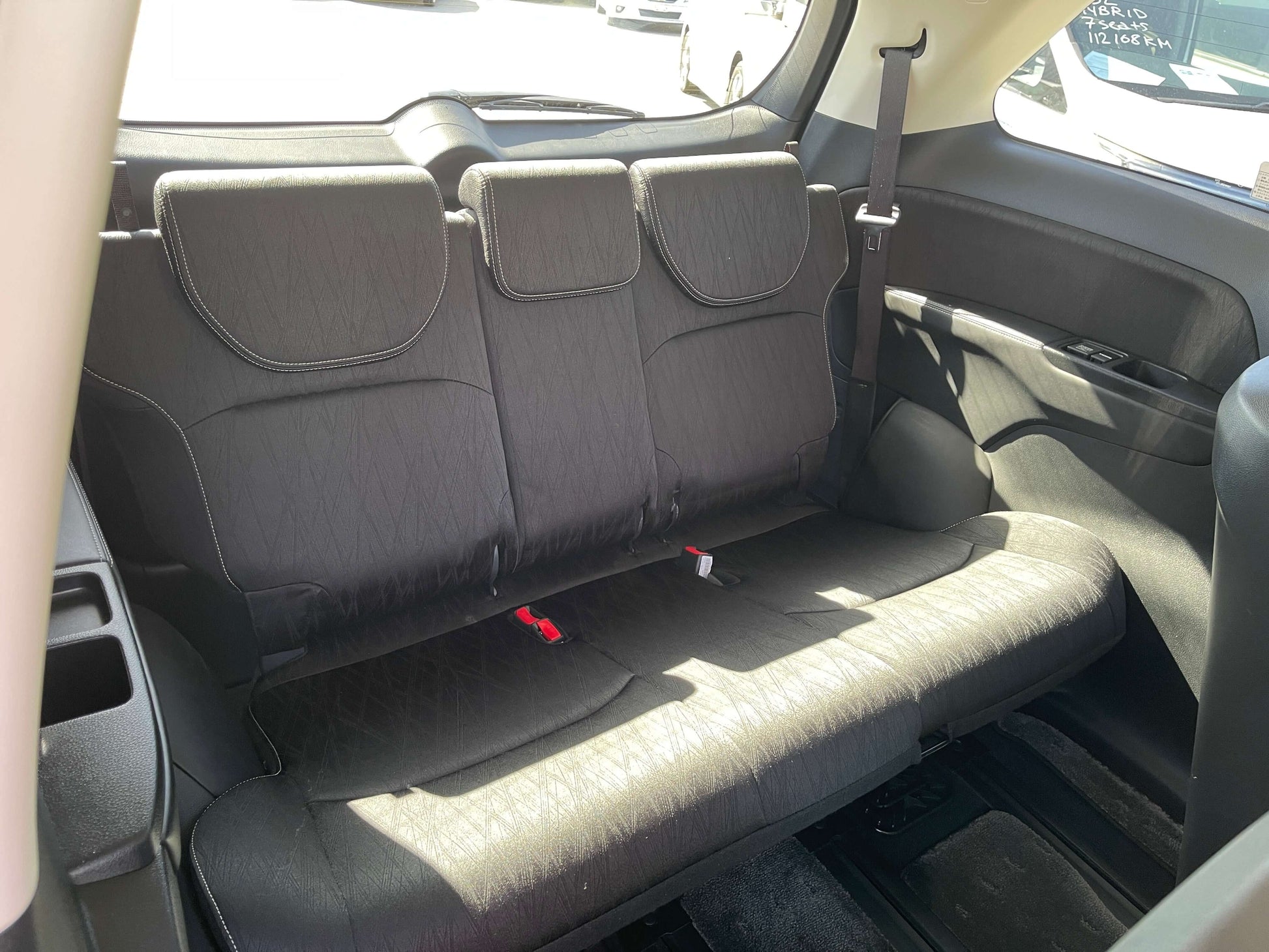 Interior of 2016 Honda Odyssey 2.0 Hybrid showing spacious back seats and seating arrangement for 7 passengers.