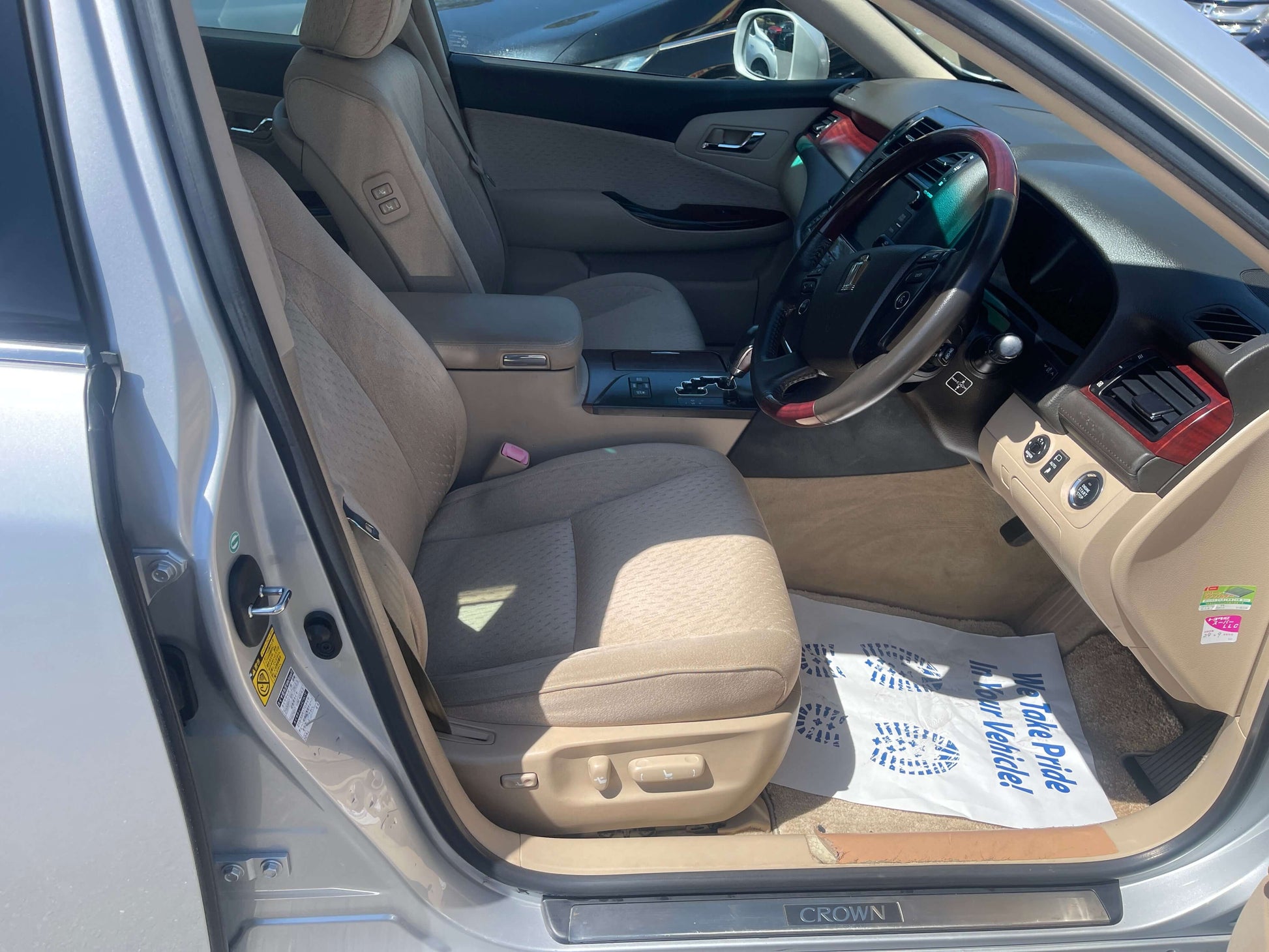 Interior view of 2008 Toyota Crown V6 3.0L Royal Saloon Luxury Sedan showing comfortable seating and controls.