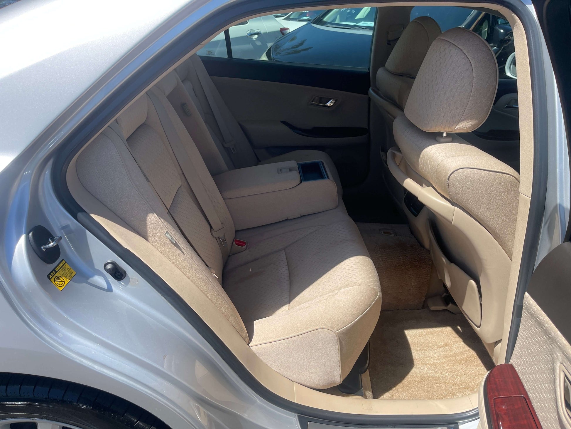 Interior view of the rear seating area in a 2008 Toyota Crown V6 3.0L Royal Saloon Luxury Sedan.