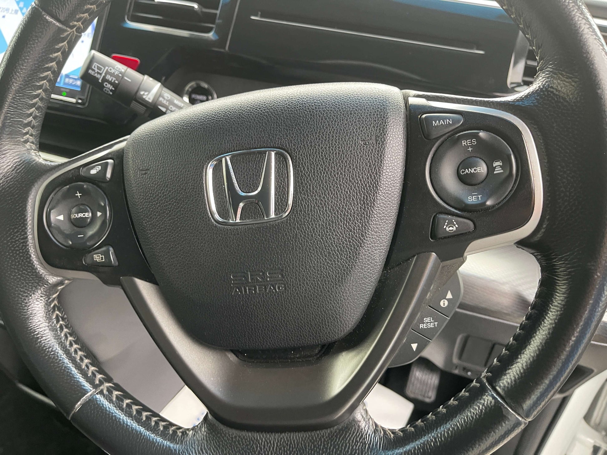 2018 Honda Honda Stepwgn 2.0 Spada Hybrid steering wheel with controls and Honda logo