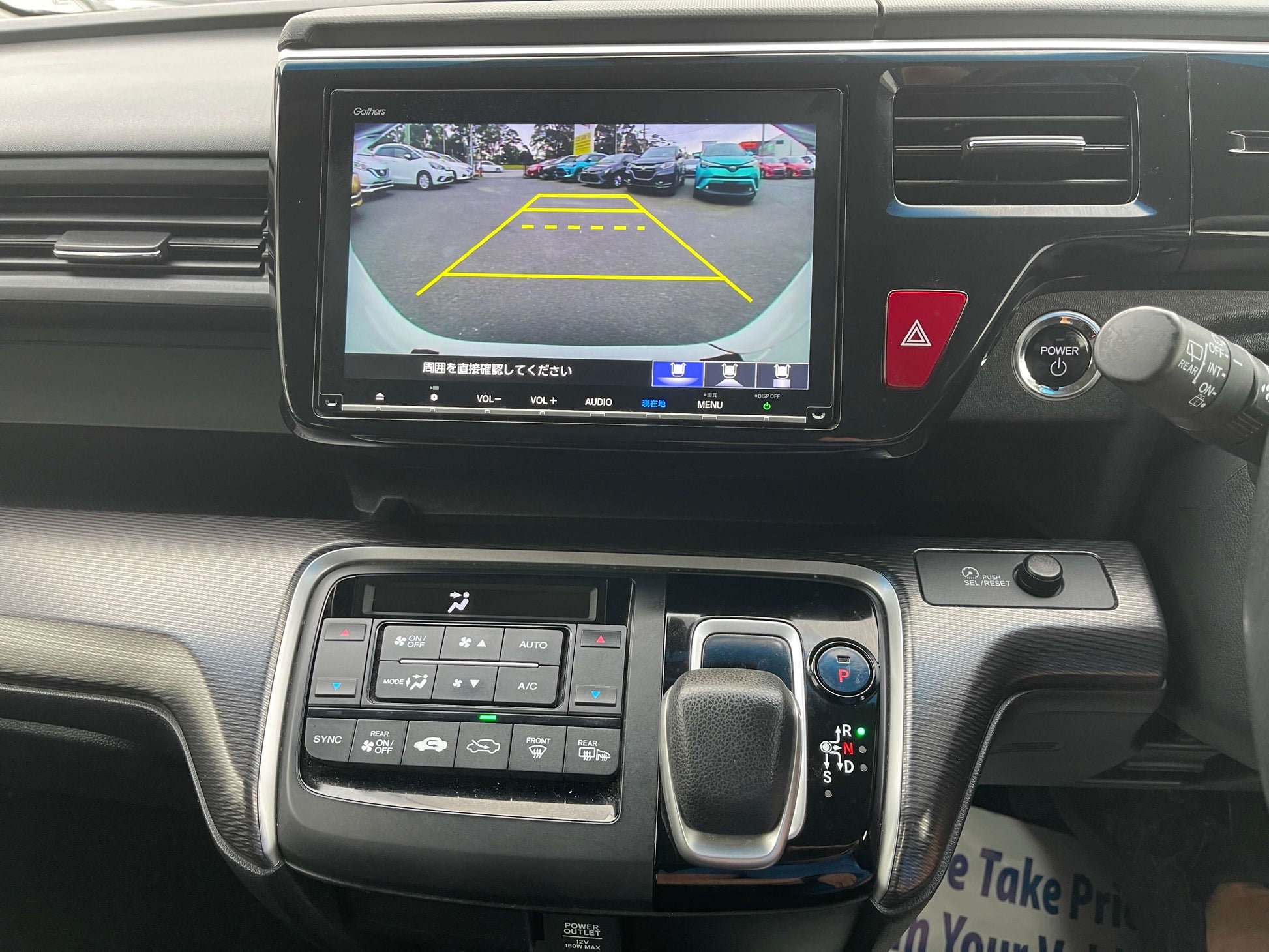 Interior view of 2018 Honda Honda Stepwgn 2.0 Spada Hybrid with infotainment screen and rearview camera display.