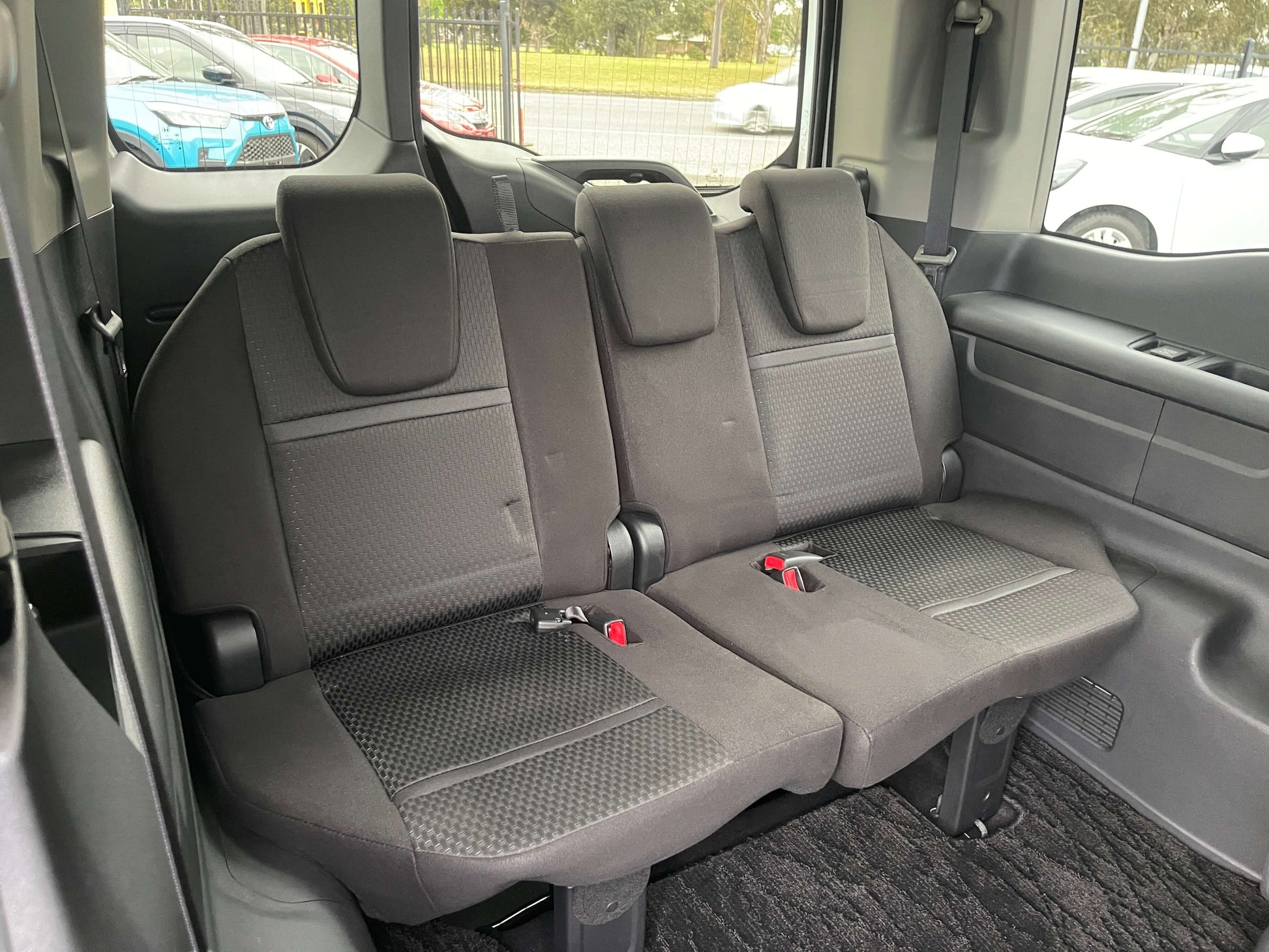 Interior view of the rear seats in the 2018 Honda Honda Stepwgn 2.0 Spada Hybrid, featuring 7-seater configuration.